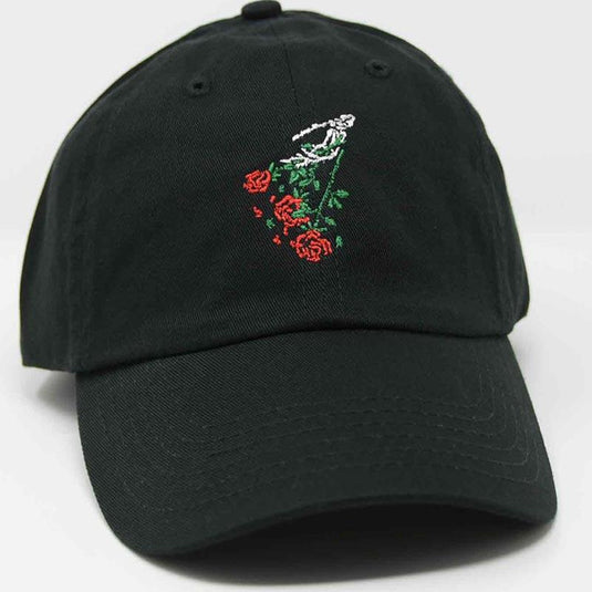 side view of skeleton hand and falling roses hat