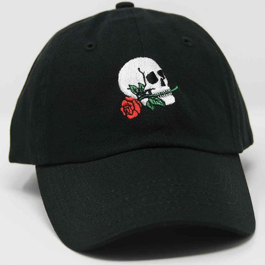 side view of skull biting red rose hat